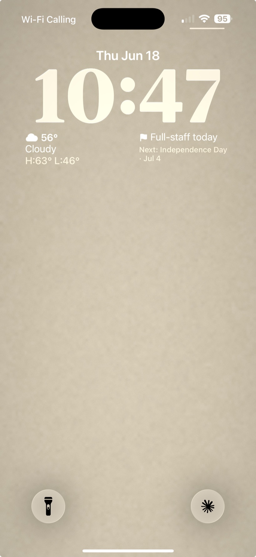 An iPhone Lock Screen showing the FlagPole widget: Full-staff today, with Independence Day named as the next flag day.